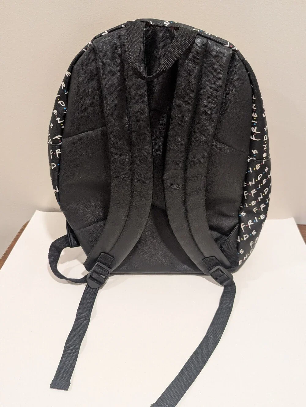 Friends Backpack all over print. need small repair see zoomed in photo